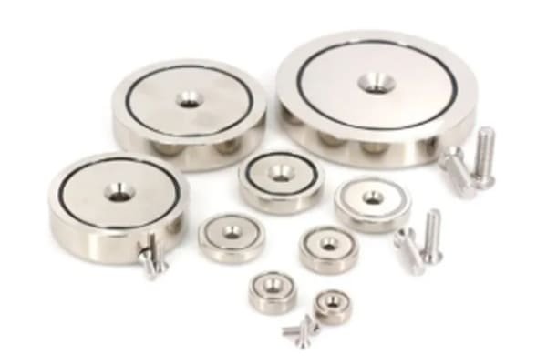 A rugged, stainless-steel-encased industrial magnet in a processing plant.